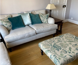 Alwinton 2 Seater Sofa in Ross Dundee Herringbone LInen & Porthallow Footstool in Floral LInen L'Oiseaux Tapestry Linen