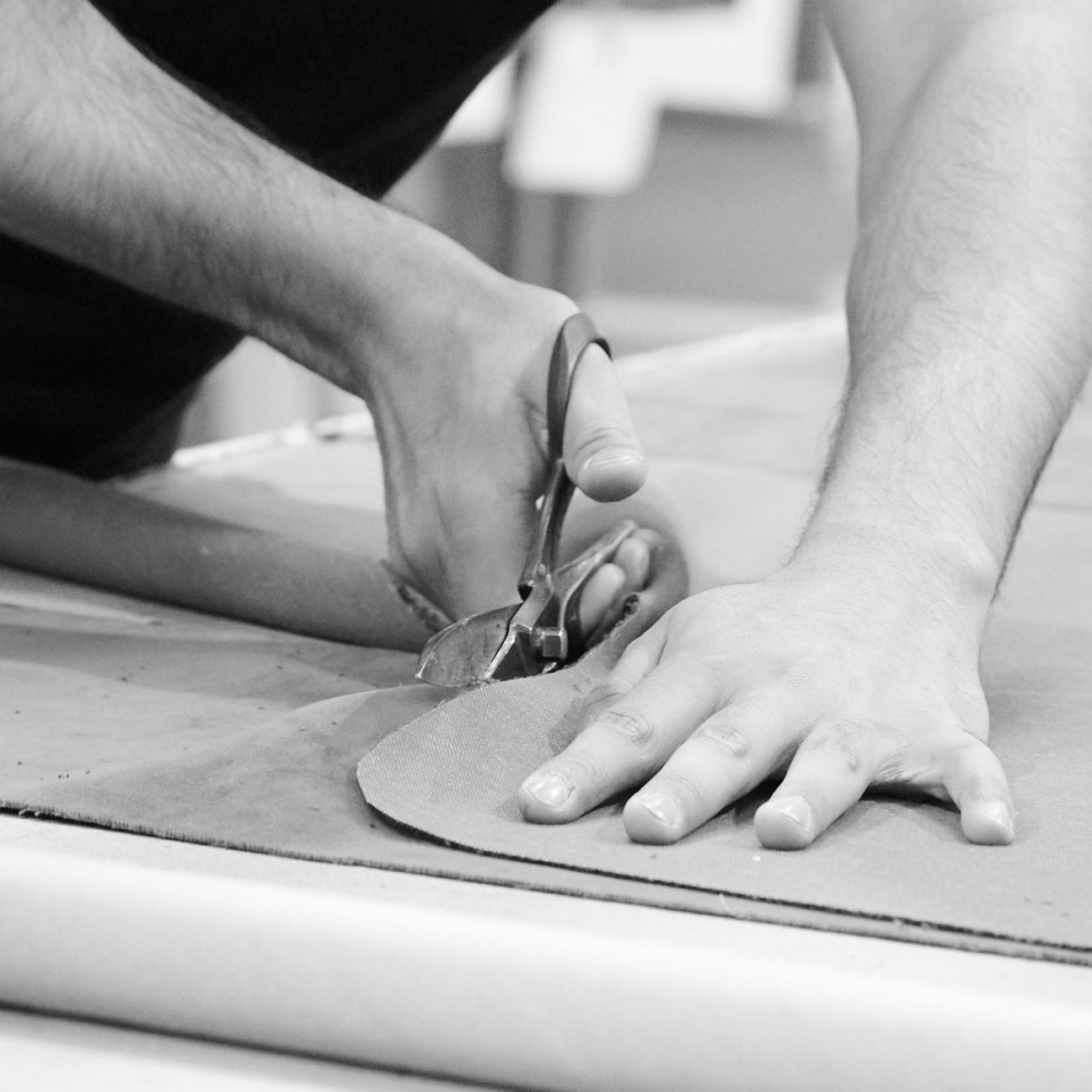 Skilled hands cutting fabric